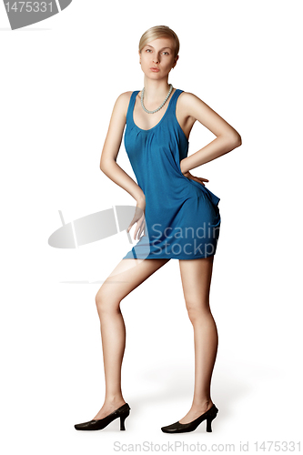 Image of blonde in blue dress posing