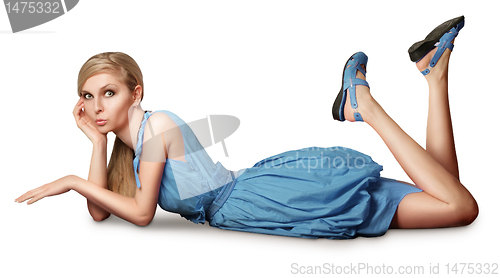 Image of blonde in pink dress lies on a floor