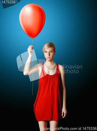 Image of blonde in red dress with the red balloon