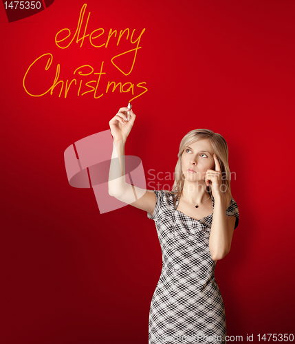 Image of businesswoman writting Merry Christmas