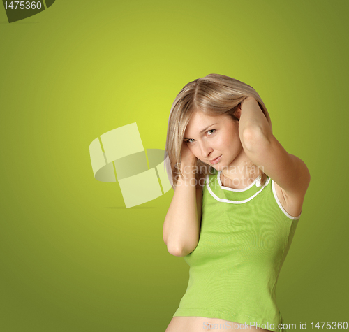 Image of cute girl with hands in her hair