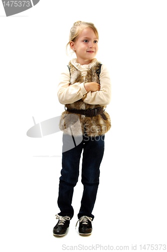 Image of Little girl in a fur vest.