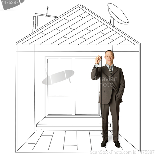 Image of asian businessman with marker in fictional house