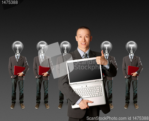 Image of lamp head businesspeople with laptop