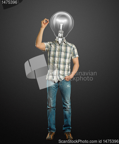 Image of asian male with lamp writting something