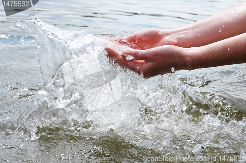 Image of hand an water