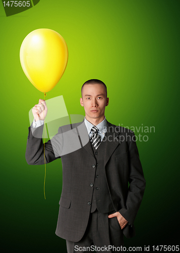 Image of businessman in suit with the balloon