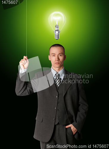 Image of business man turn on the light