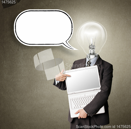 Image of businessman with lamp-head and laptop and comics bubble