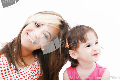 Image of Teen sister and baby sister.  Cute sisters portrait, close up, i