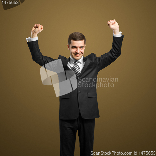 Image of businessman with hands up