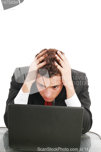 Image of Young caucasian worried businessman with a laptop
