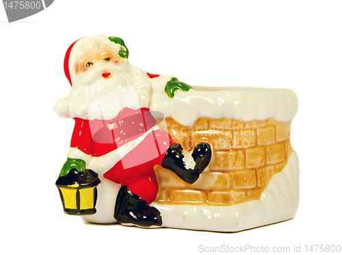 Image of Ceramic toy Santa Claus. Christmas gift symbol.