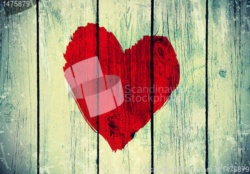 Image of love symbol on old wooden wall