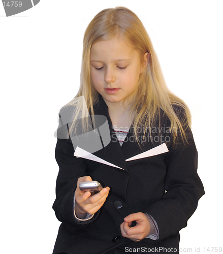 Image of Young girl dialing phone number