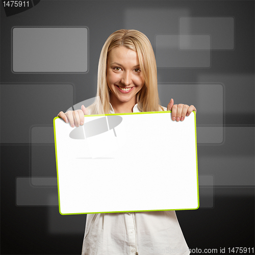 Image of happy businesswoman holding blank white card