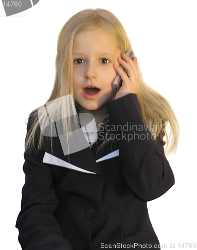 Image of Young girl dialing phone number