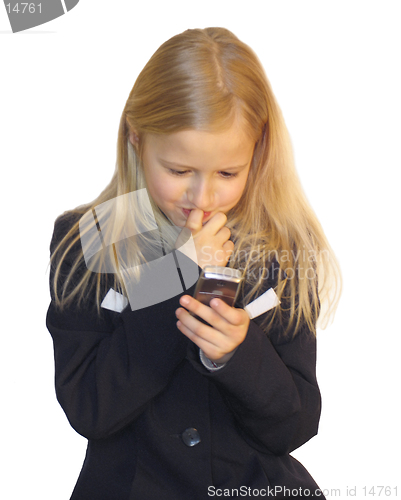 Image of Young girl dialing phone number