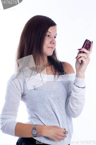 Image of Pretty woman talking by mobile phone