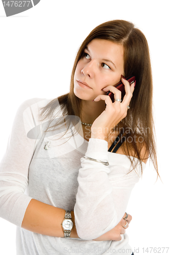 Image of Pretty woman talking by mobile phone