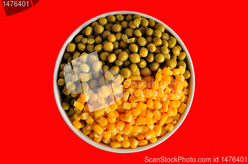 Image of corn and peas on red