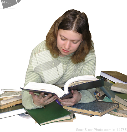 Image of Student girl reading on the heap of books