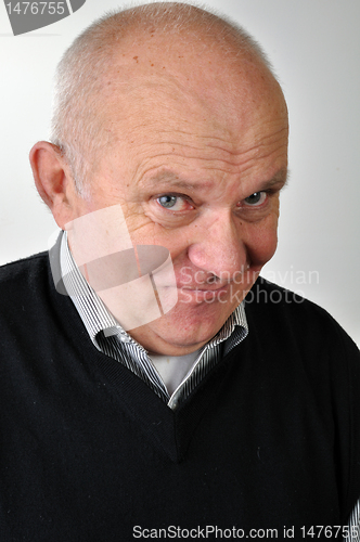 Image of senior man with ironic face expression
