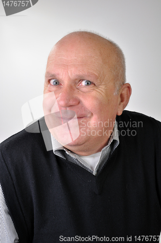 Image of senior man making funny faces