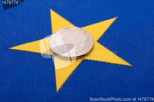 Image of Euro Coin on EU Flag