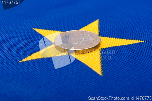 Image of Euro Coin on EU Flag