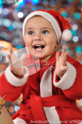 Image of happy Christmas clapping baby girl