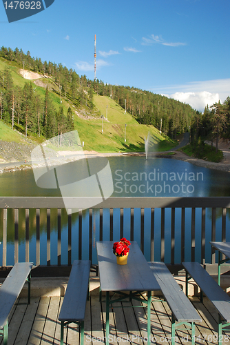 Image of Vew at Ruka lake with fontain and hill from the terrase