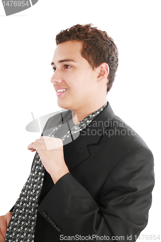 Image of An young man fixing his tie 