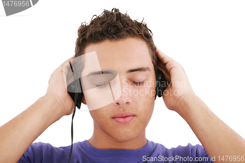 Image of Boy listening to the music, isolated on white