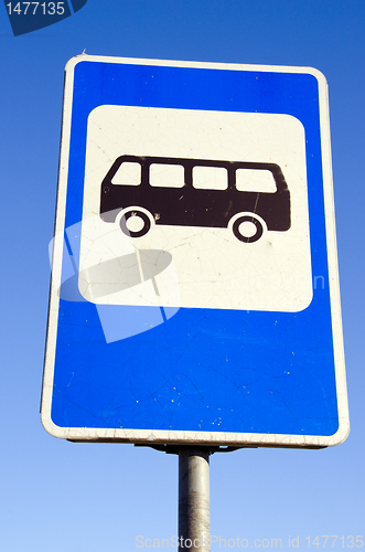 Image of Bus stop road sign on background of blue sky.