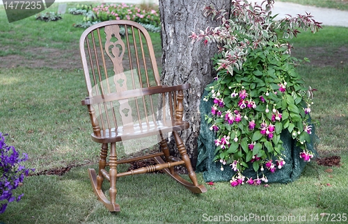 Image of Rocking chair and flowers