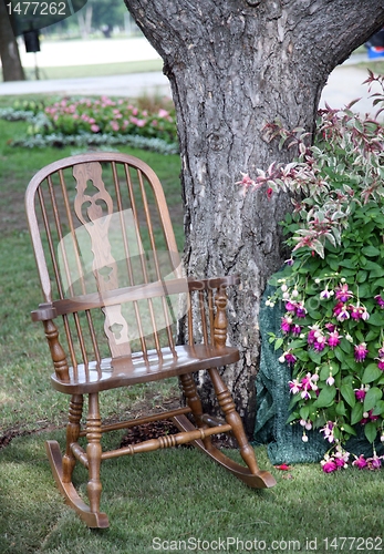 Image of Rocking chair and flowers