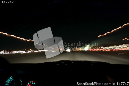 Image of Highway Traffic and Lights at Night