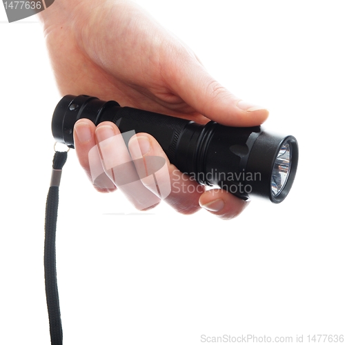 Image of hand and flashlight