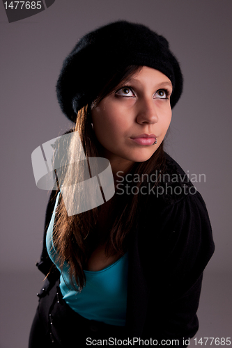 Image of Beautiful young woman with hat