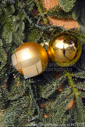 Image of Christmas yellow toys, plastic branches imitation.
