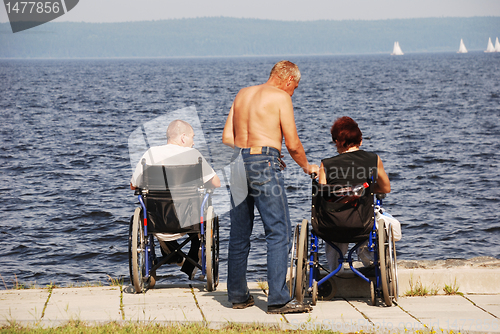 Image of Disabled people in wheelchairs on the embankment