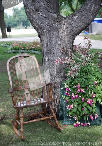 Image of Rocking chair and flowers