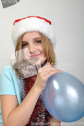 Image of cute xmas girl with a balloon