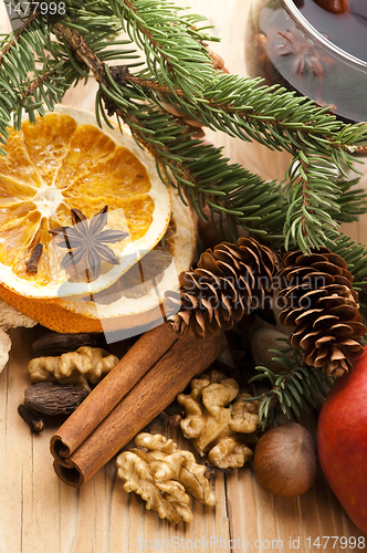 Image of Different kinds of spices, nuts and dried oranges - christmas de