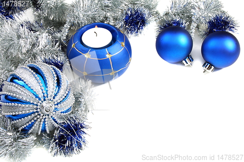 Image of Christmas still life with blue balls and tinsel.