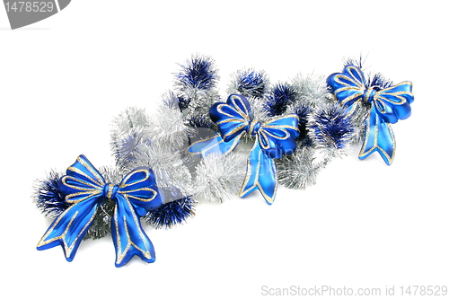 Image of Christmas garland with blue ribbons.