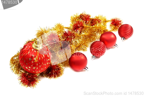 Image of Christmas balls and a gold tinsel.
