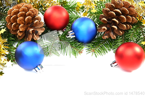 Image of Christmas balls against the backdrop of tinsel.