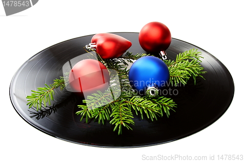 Image of Christmas still life with a vinyl disc and balls.